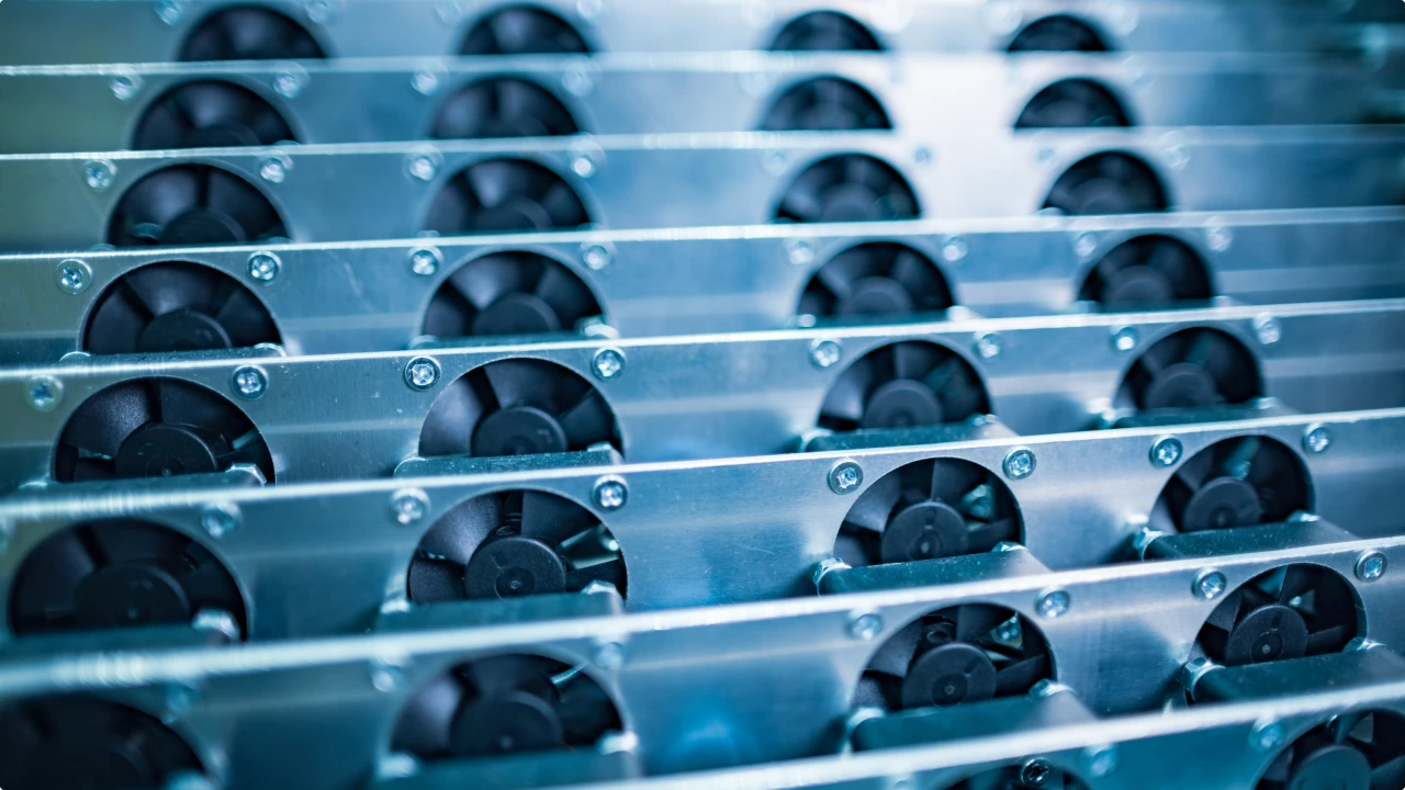 Coolant distribution unit with circulation pumps serving AI server racks in a data center